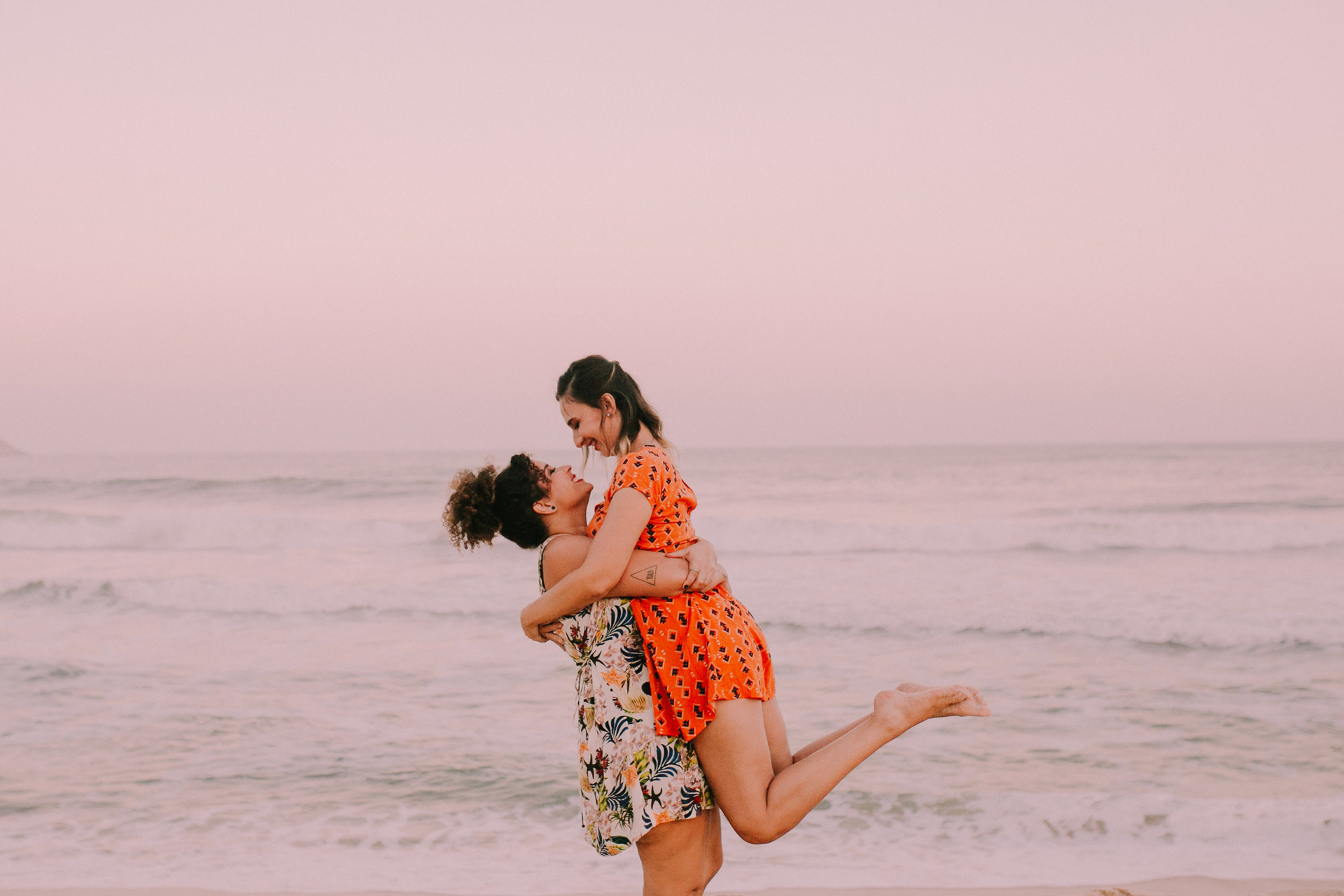 Couple hugging by the sea on holiday