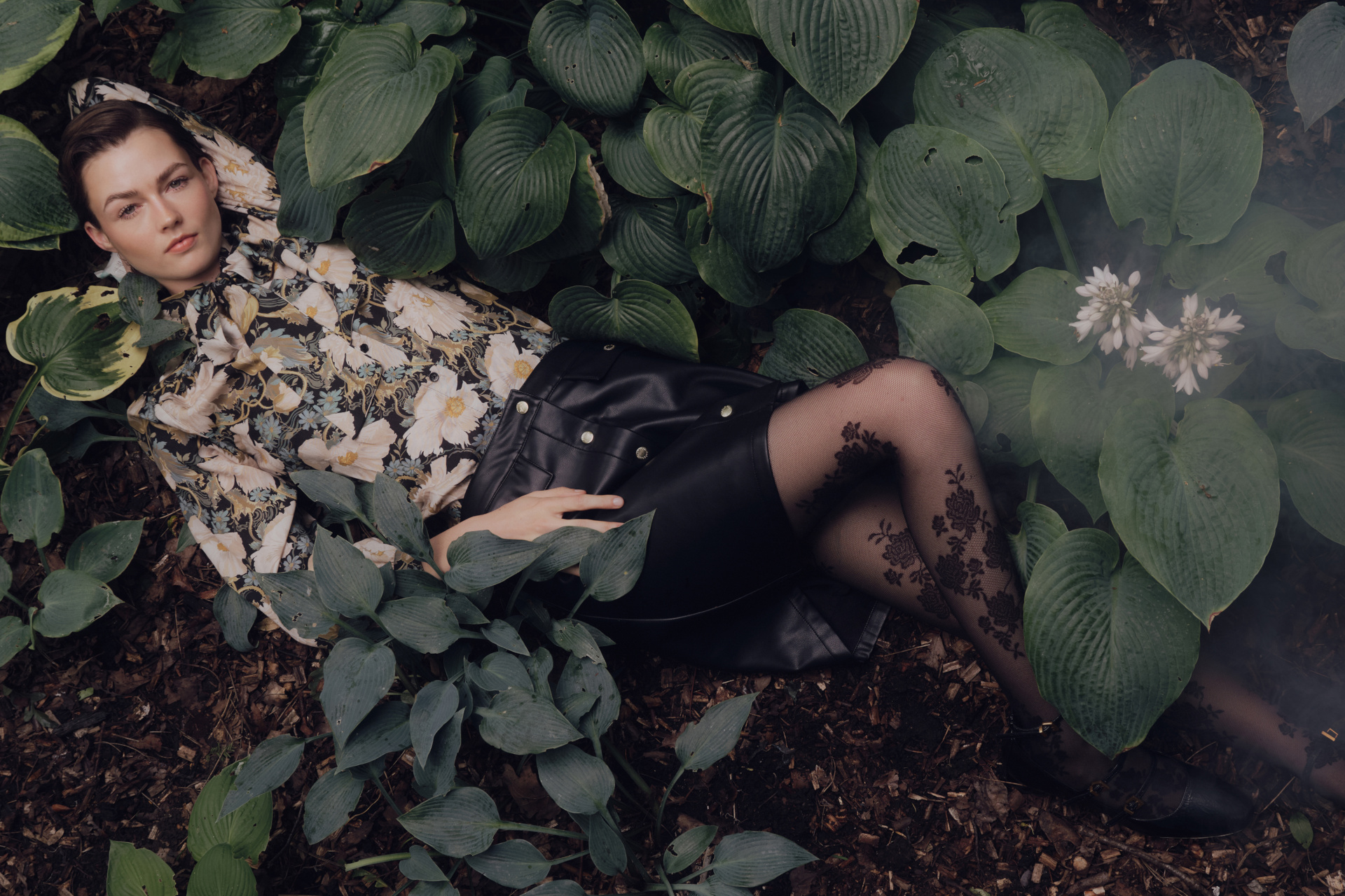 Woman lying down in leaves