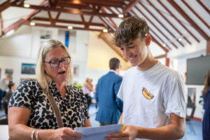 Bede's Senior School pupil opening their GCSE results