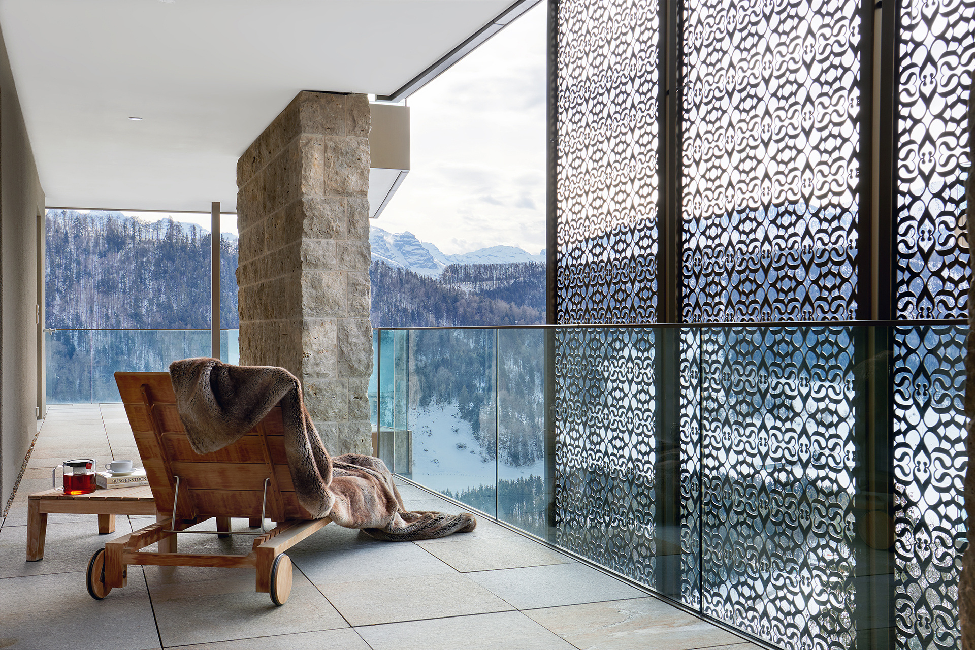 Lounger and balcony overlooking sweeping landscape view