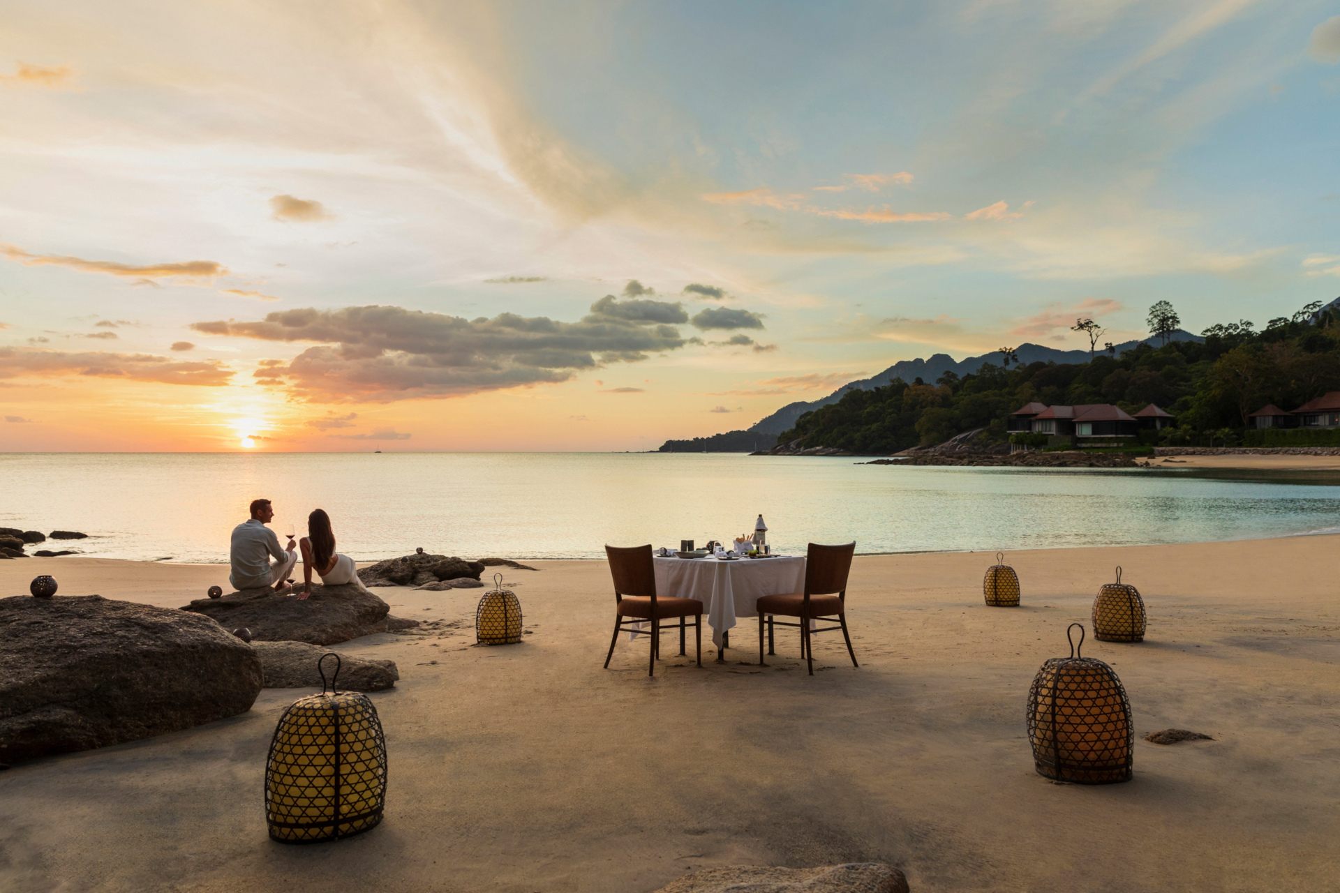 Couple having dinner on the beach