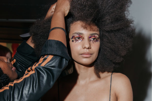 Woman getting makeup done