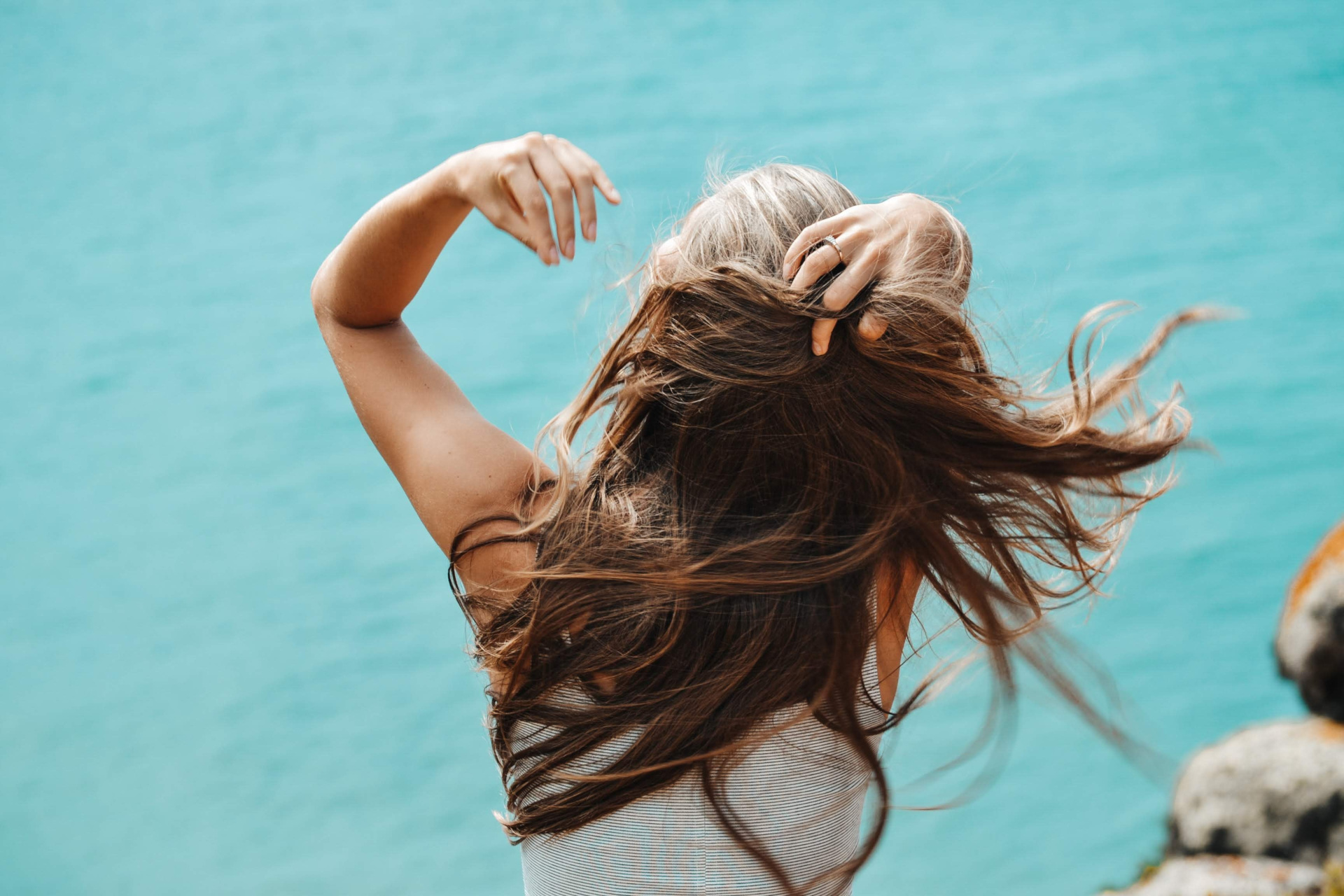 Woman pushing hair back