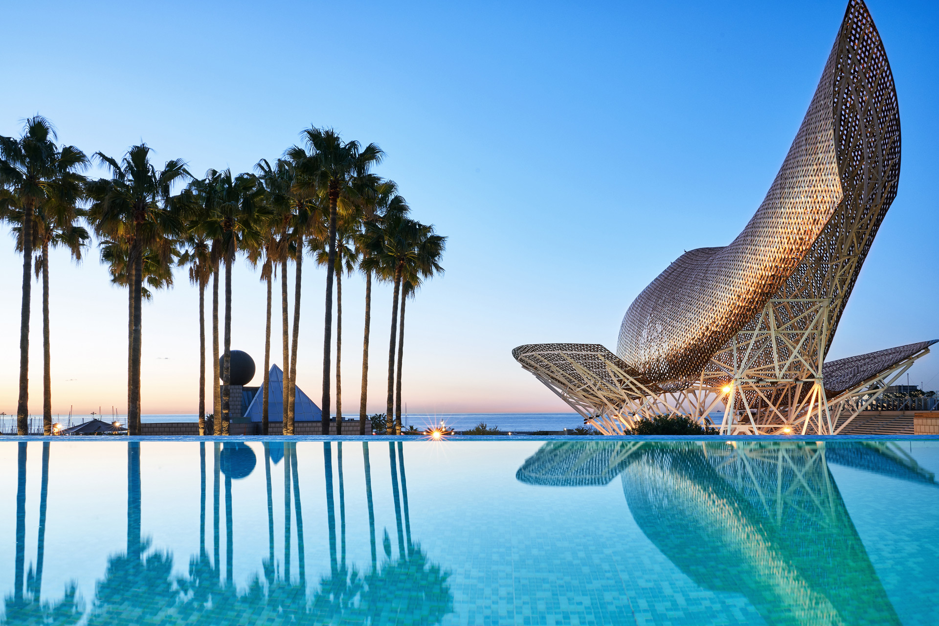 Infinity pool with gold sculpture at Hotel Arts Barcelona
