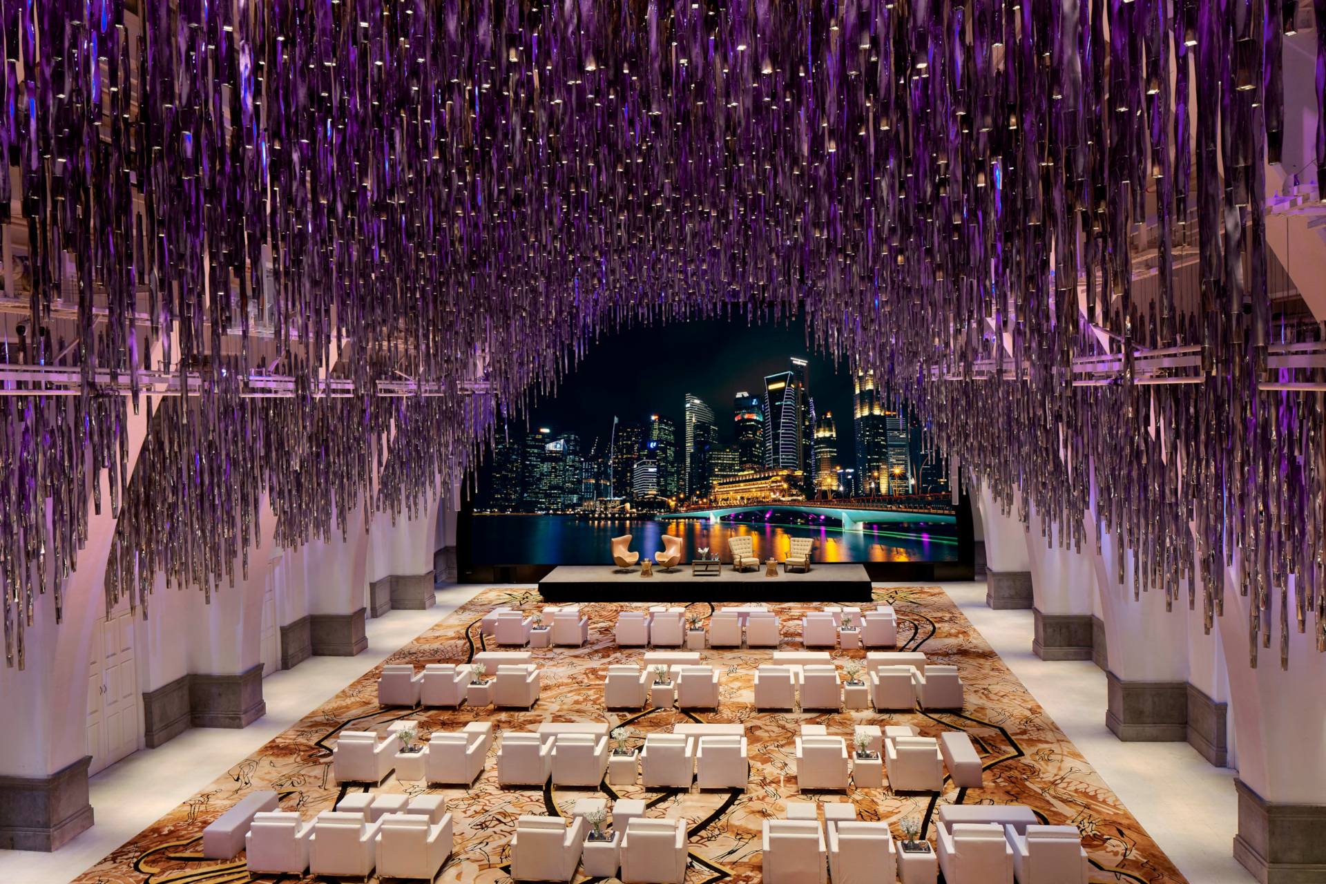 Ballroom with purple hanging display and window overlooking city