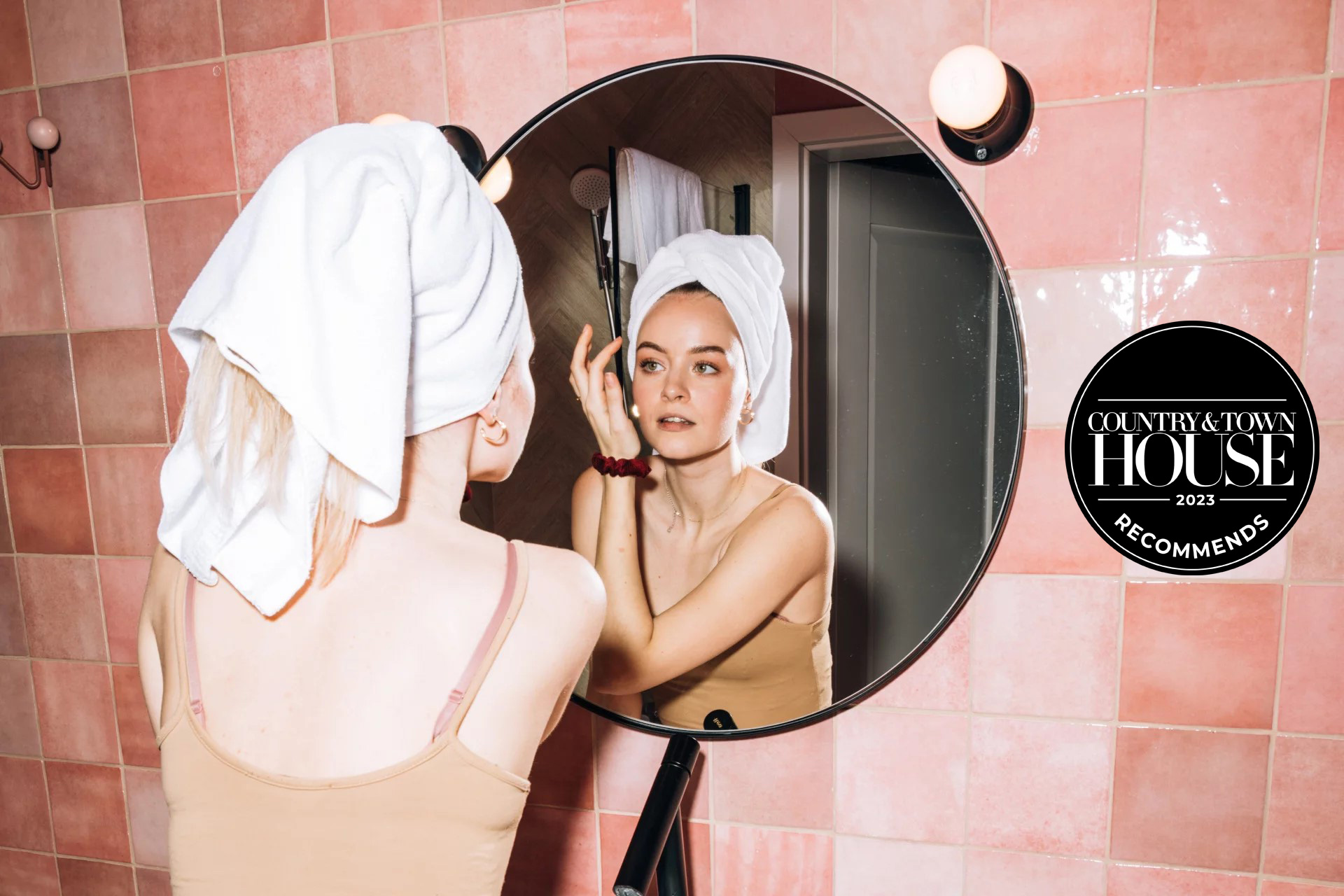 Woman doing make-up in the mirror