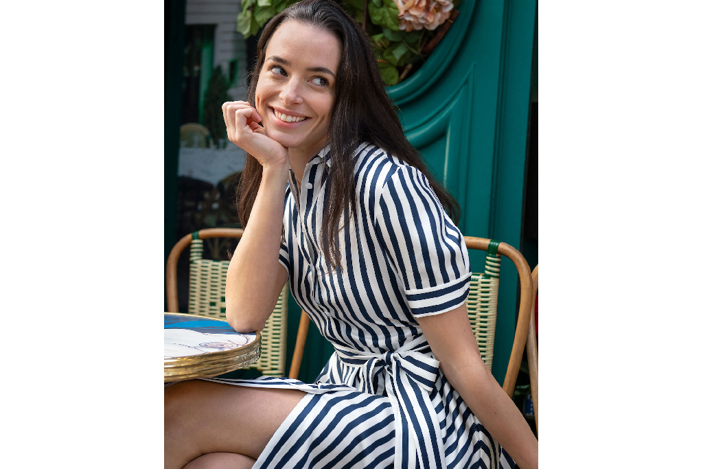 Woman sat down in stripe dress