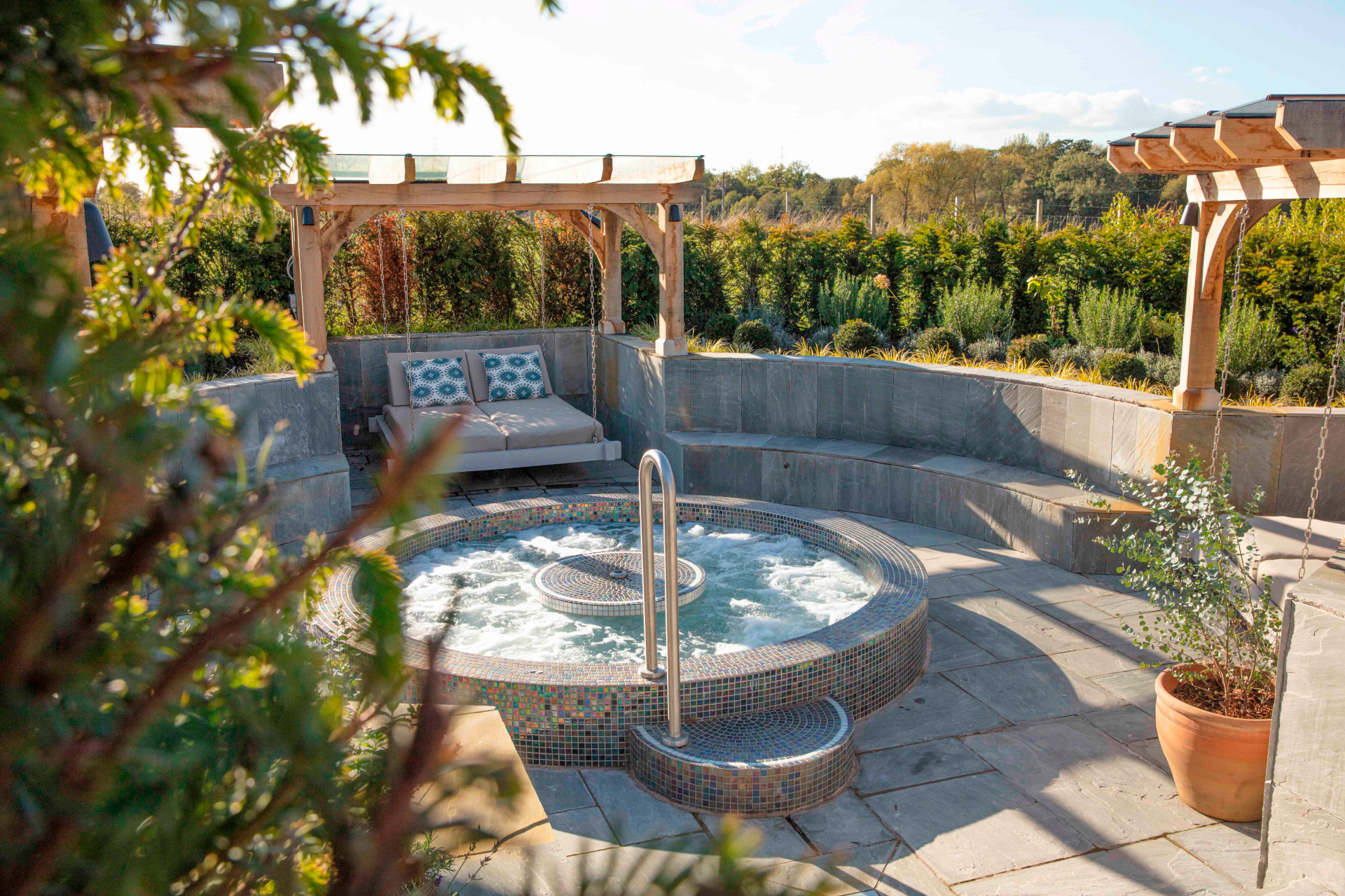 Outdoor hot tub with swing beds at Manor House Hotel & Spa, Alsager