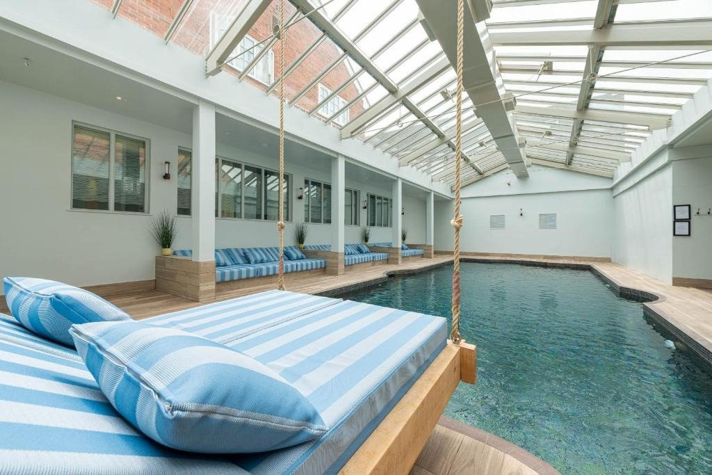 Swing bed by indoor pool