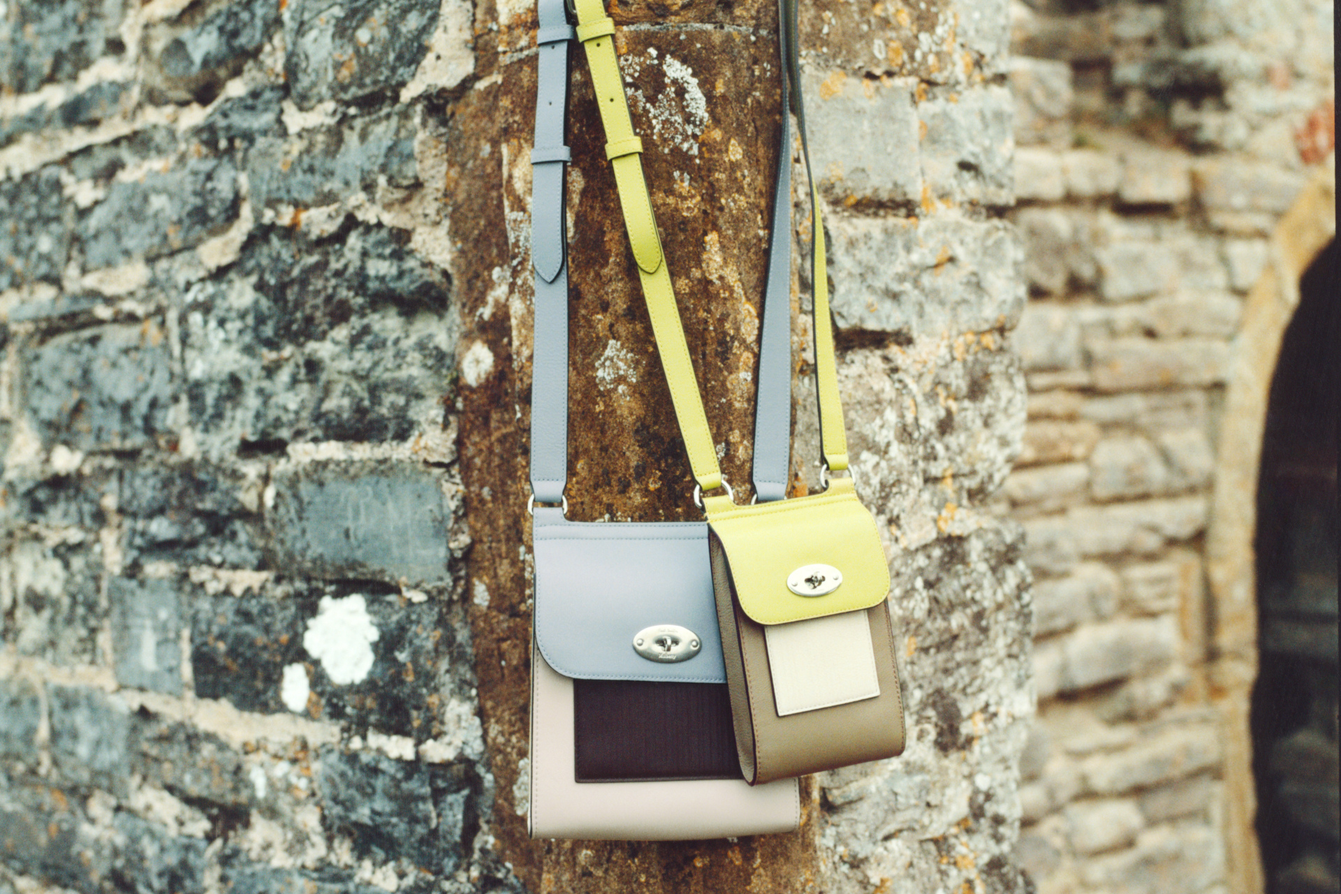 Bags hung up on brick wall