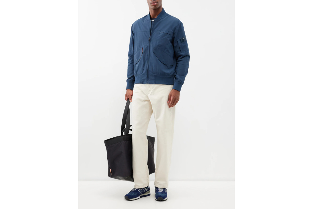 Man in blue coat and white trousers