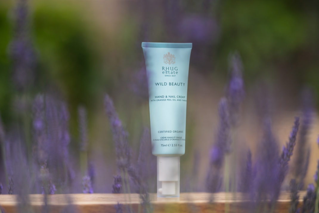 Blue hand cream surrounded by lavendar