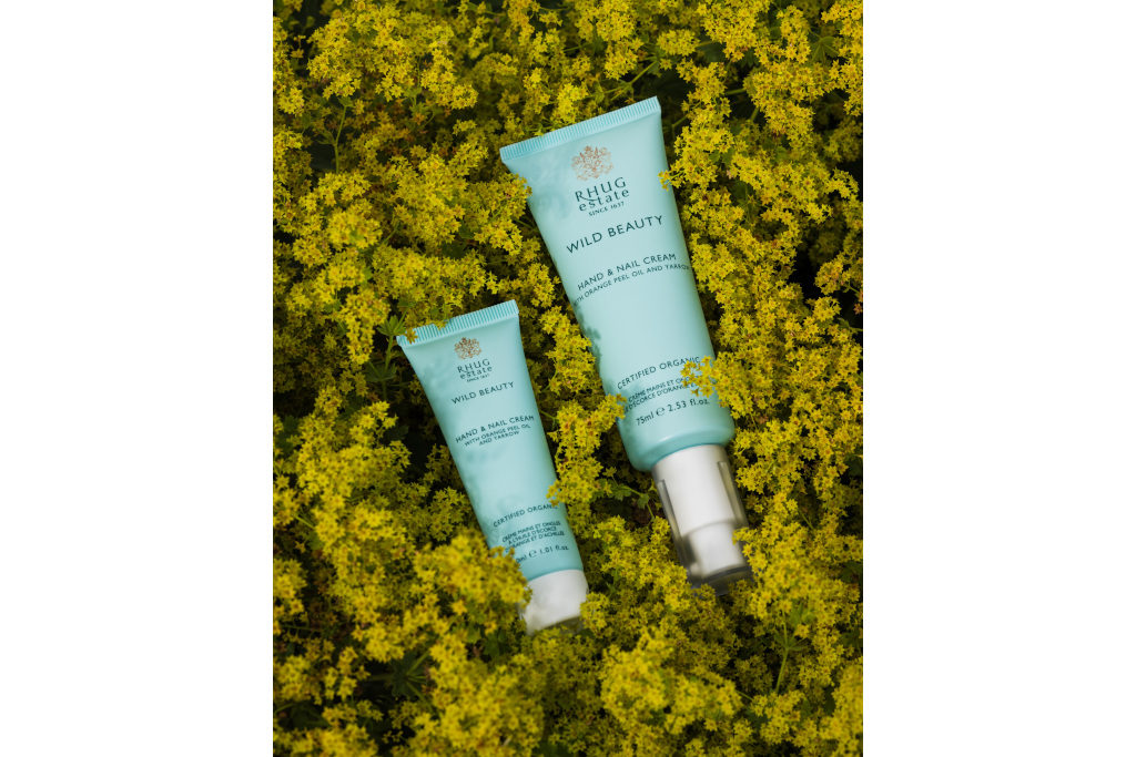 Blue hand creams set on moss