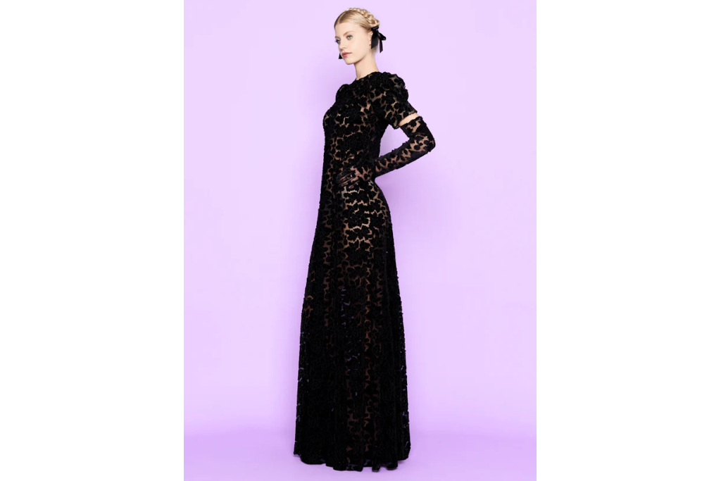 Woman in black dress on purple background