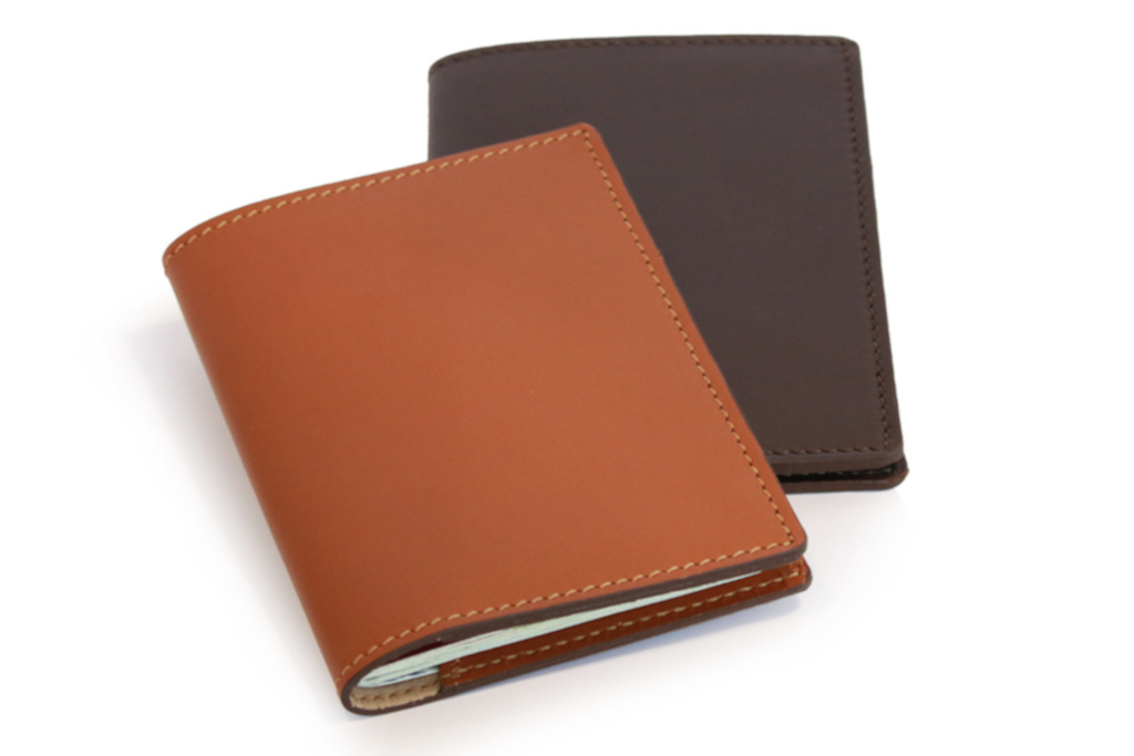 Brown and black leather passport holders