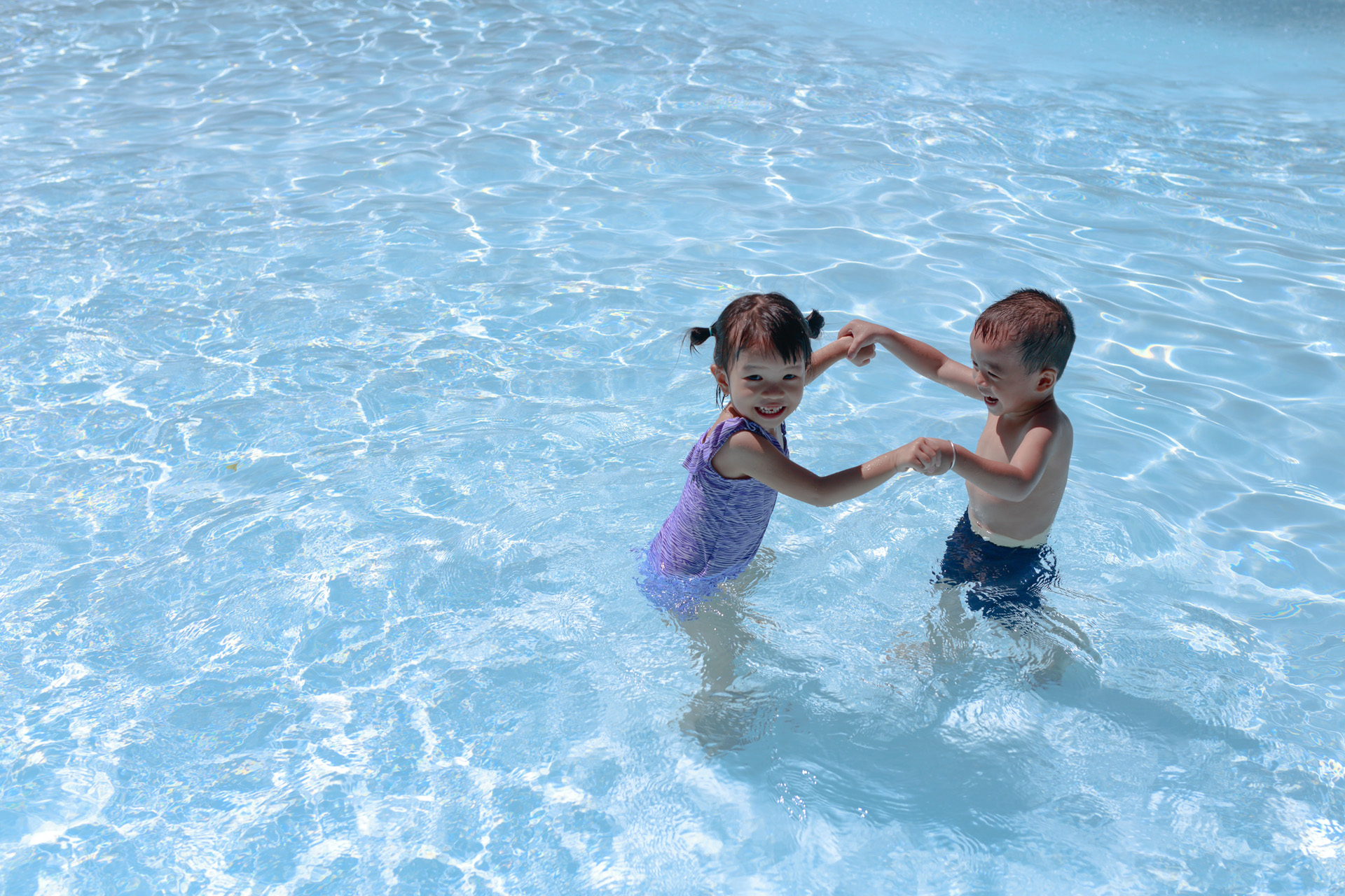 Two young kids at a water park