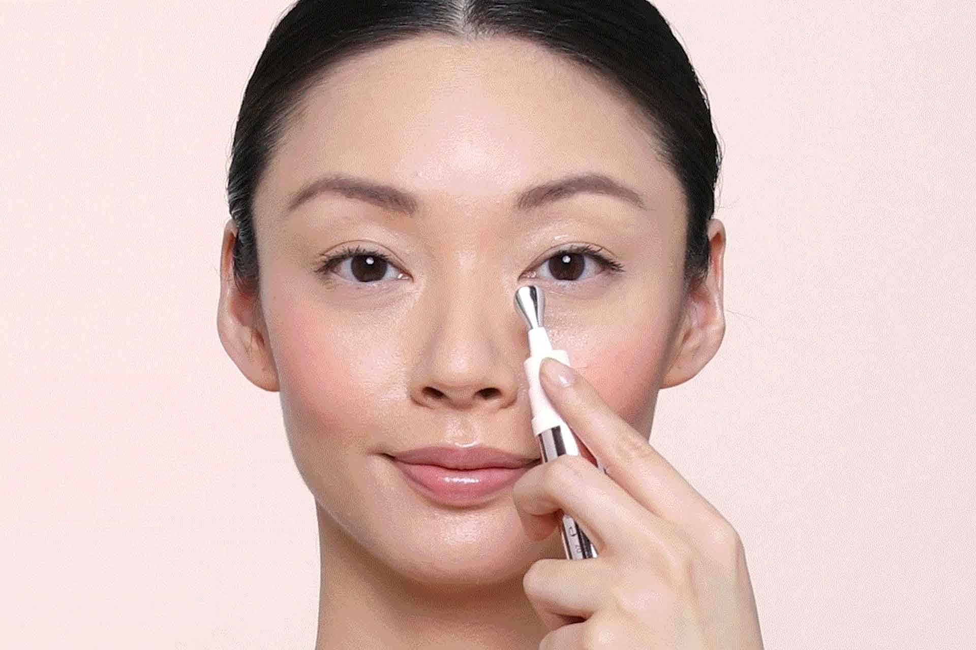 model applying eye cream