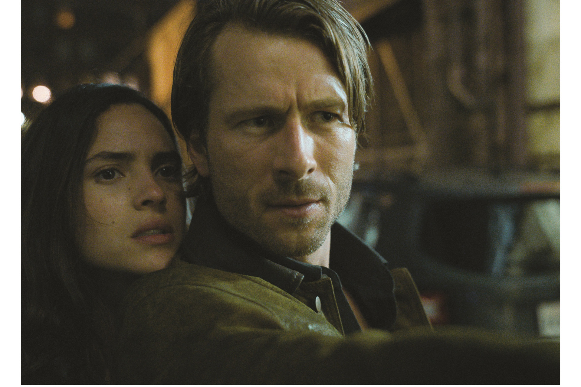 Adria Arjona and Glen Powell in Hit Man