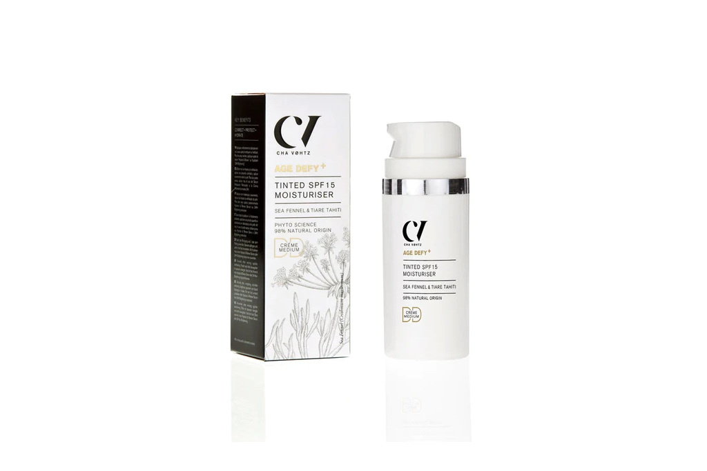 White skin cream bottle next to matching box