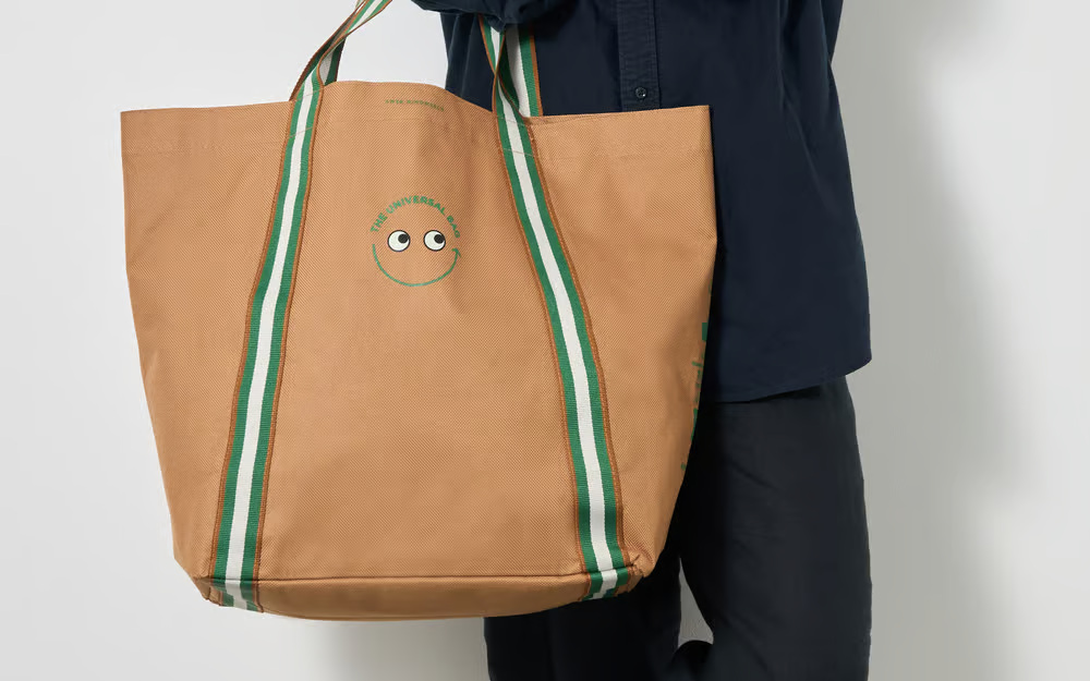 Woman holding brown bag