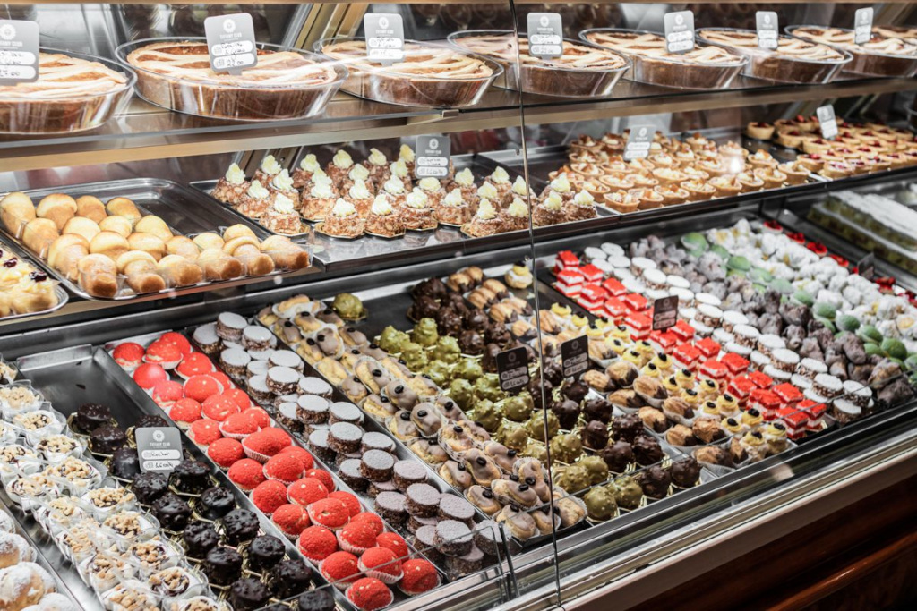 Cakes and sweets in a glass showcase