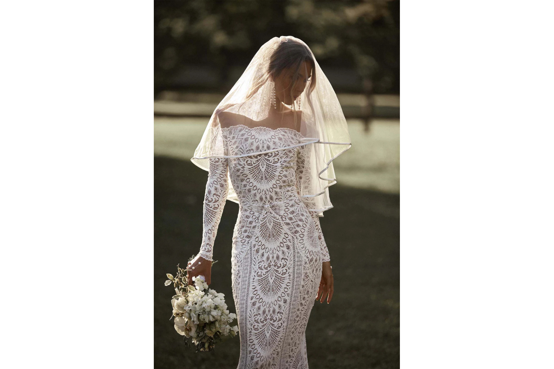 Woman in boho wedding dress and veil