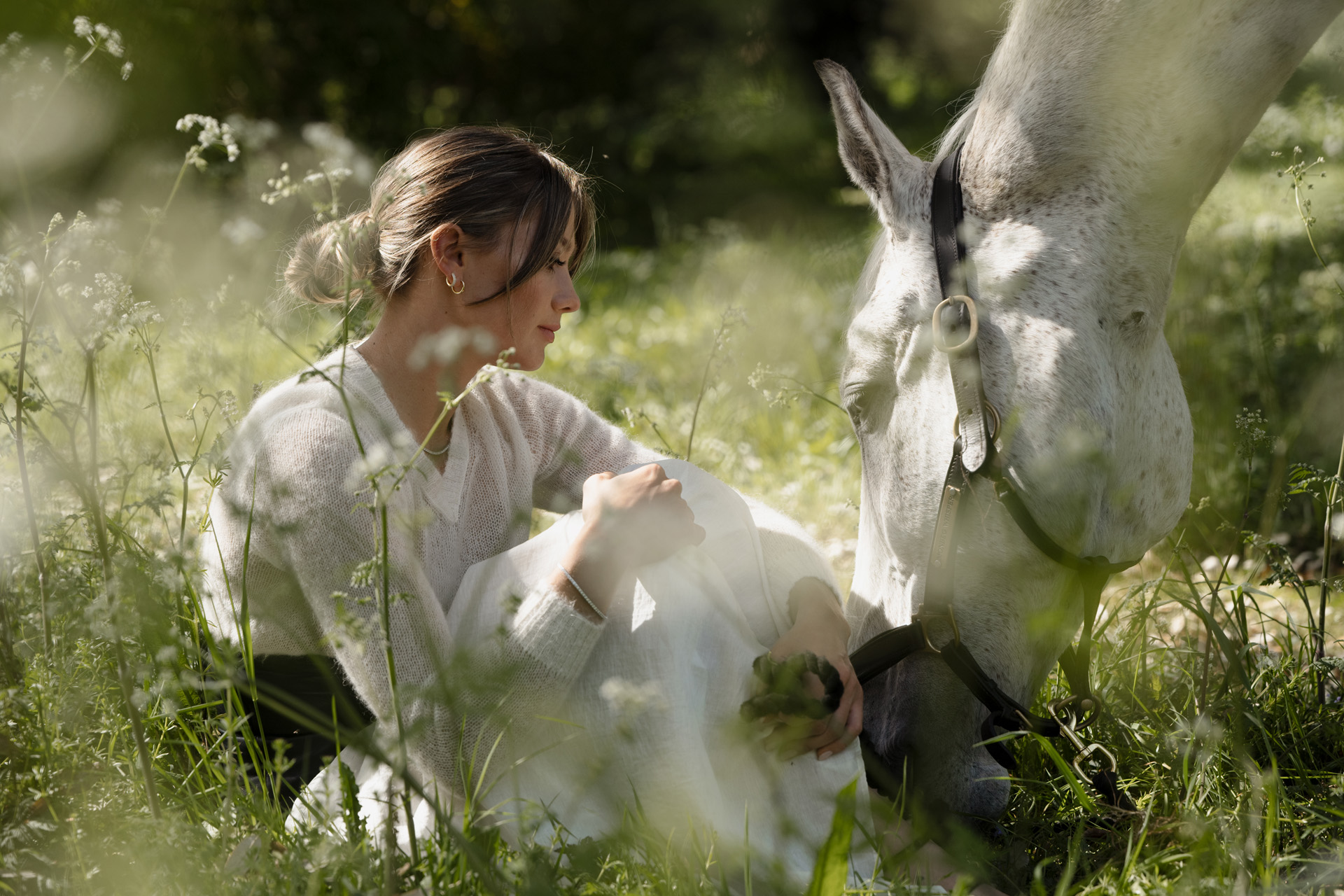 Jemima with a horse in a meadow
