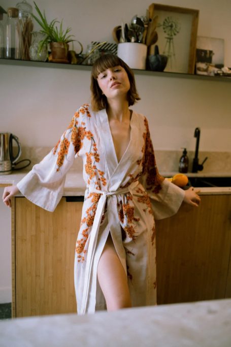 Woman wearing floral white and orange kimono