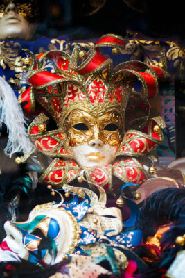 Carnival masks piled in shop window | London fancy dress shops