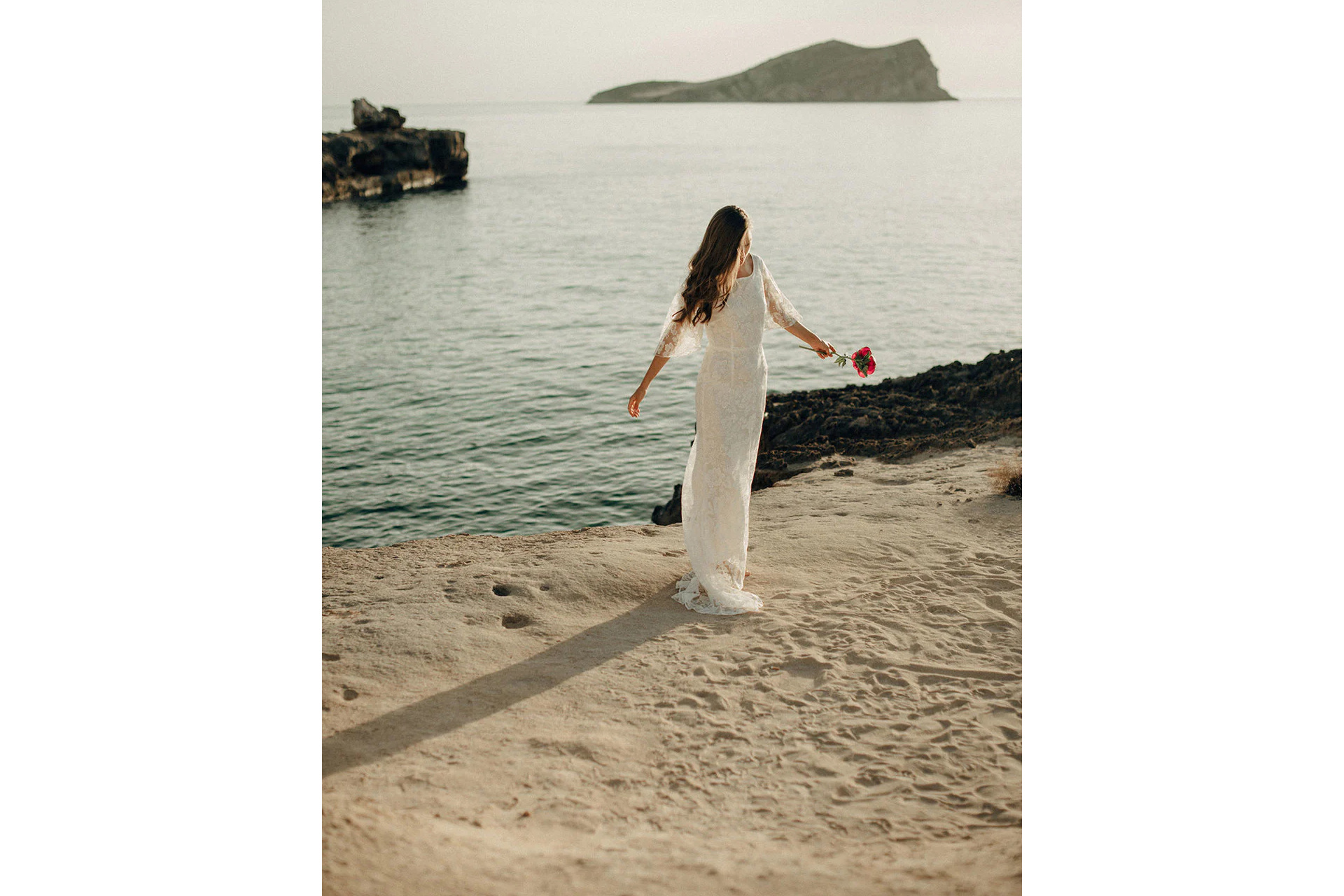 Woman in wedding dress on beach | boho wedding dresses