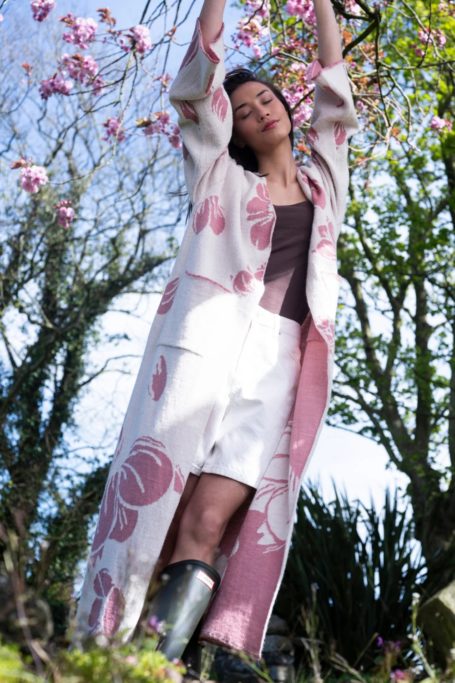 Woman wearing white and pink NIAO coat