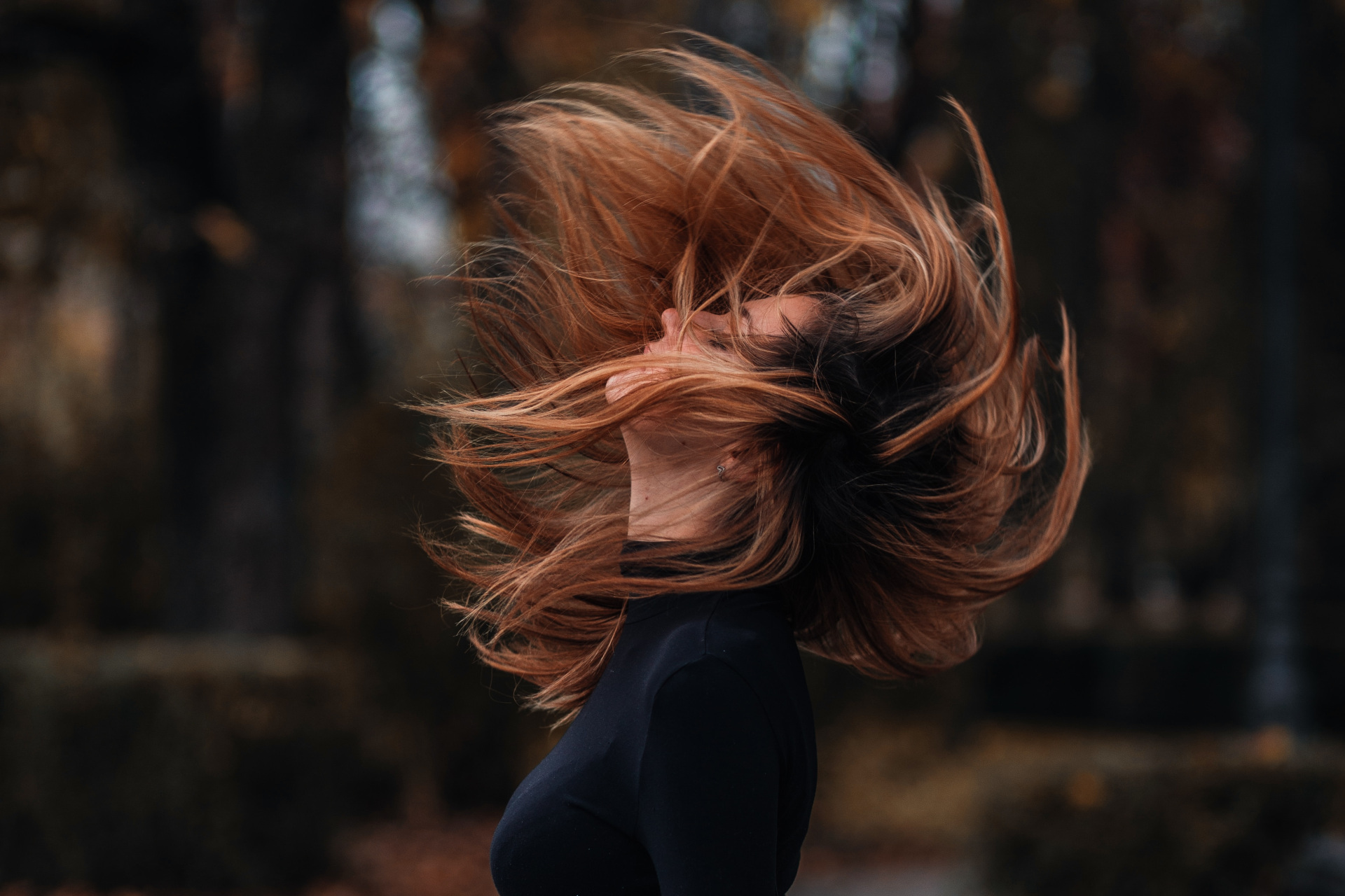 Woman throwing head back