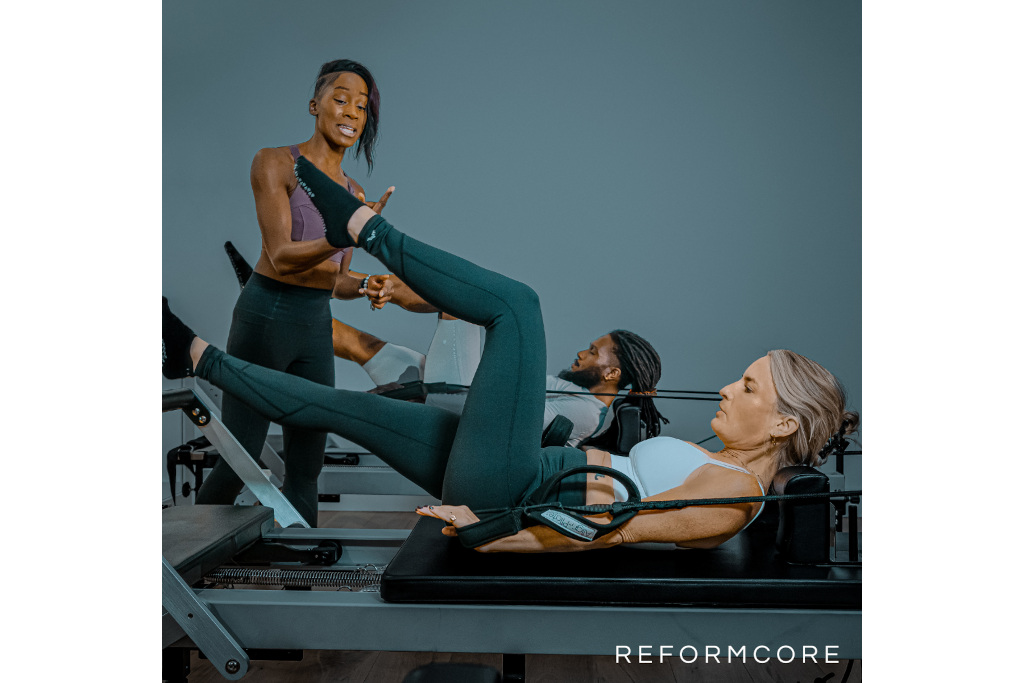 People doing reformer Pilates