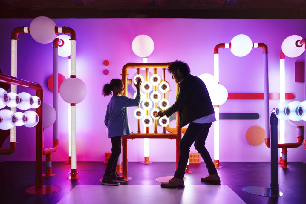 Visitors playing in the musical playground in Turn It Up at the Science and Industry Museum