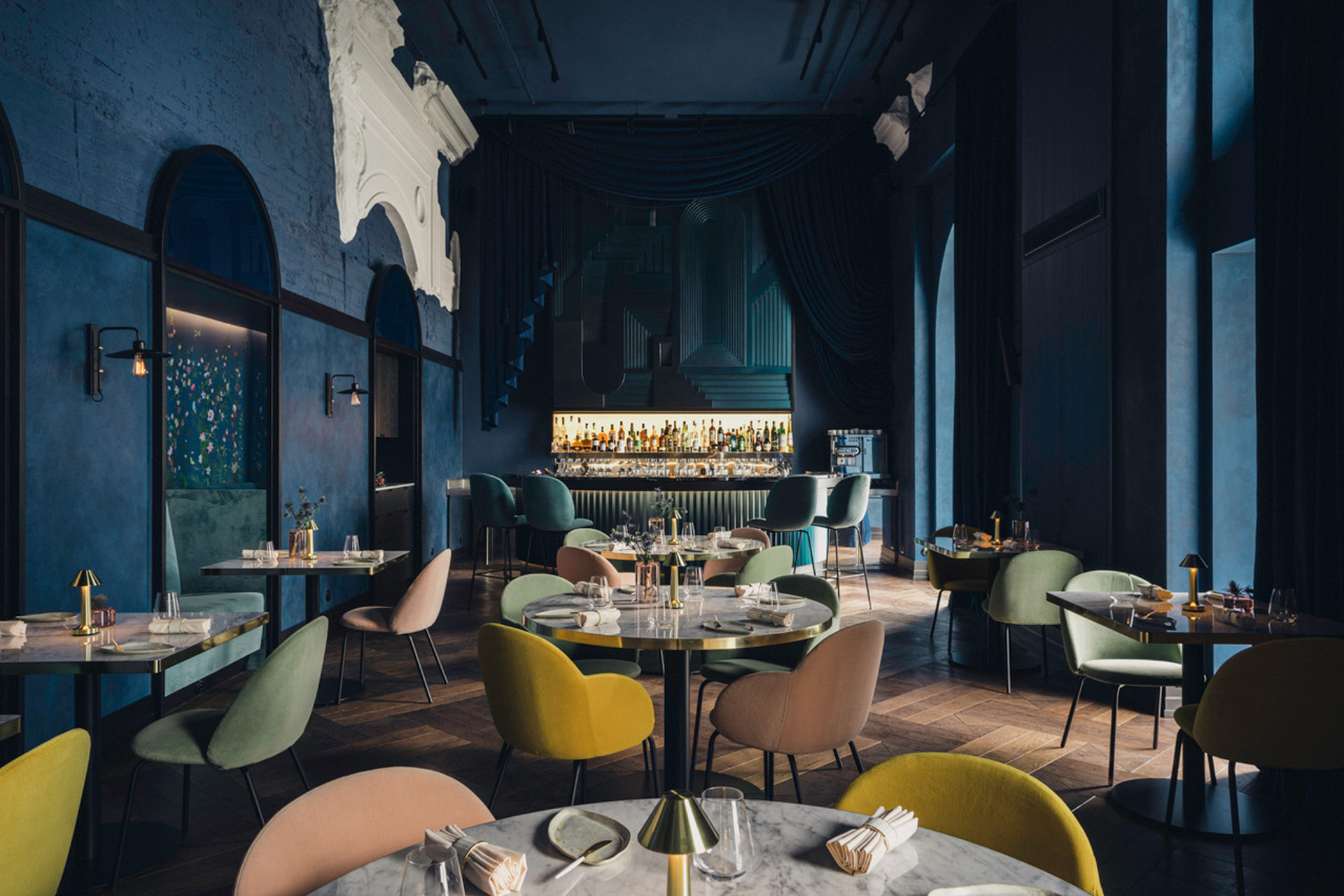 Navy blue-painted dining room at Epoka, Warsaw.