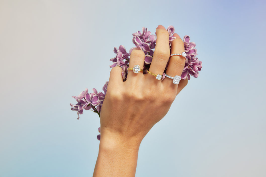 hand with skydiamond lab-grown diamond rings