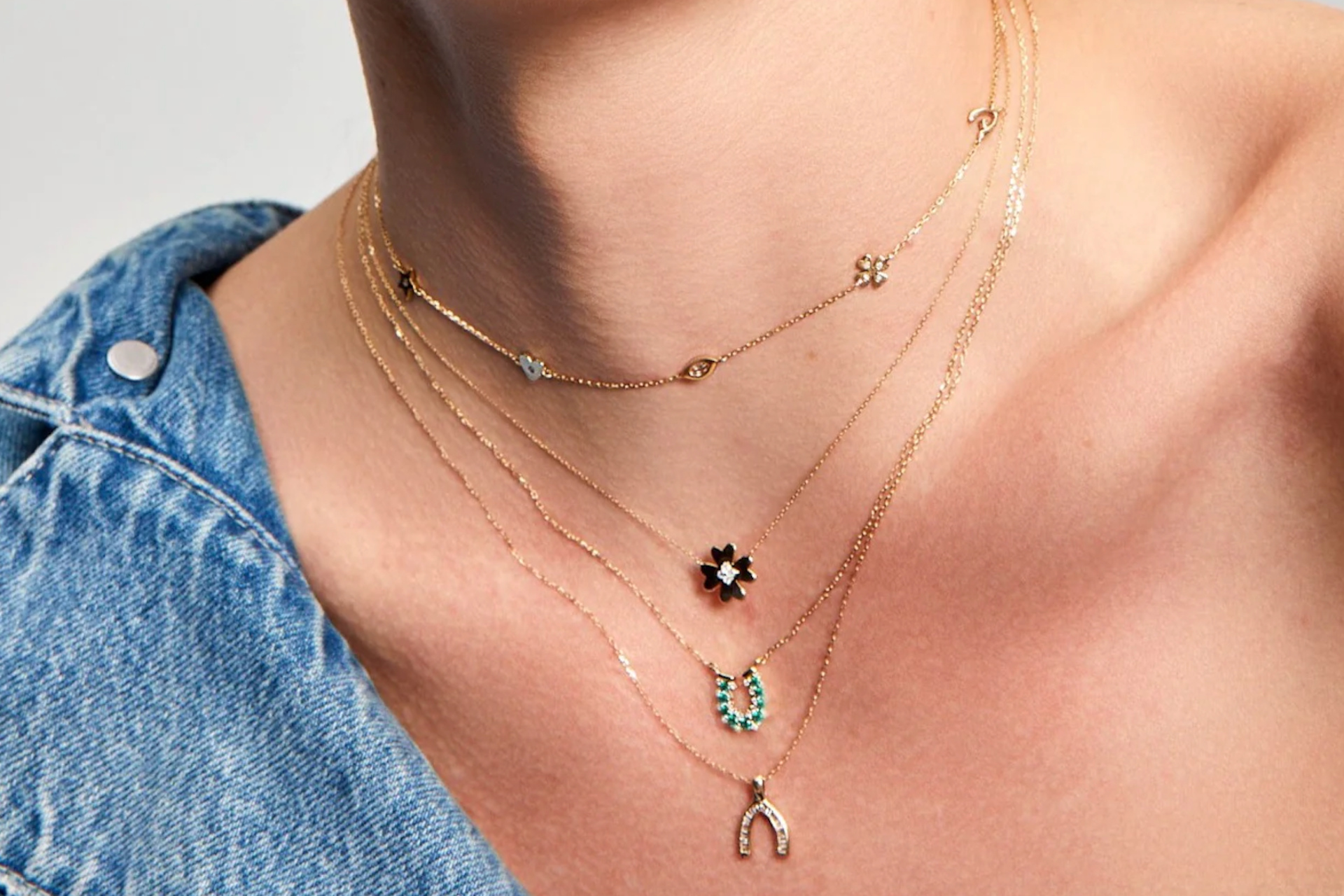 Close up of neck wearing necklaces