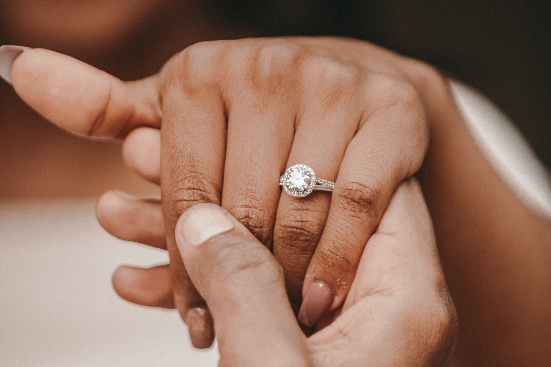 Close up of hand with engagement ring