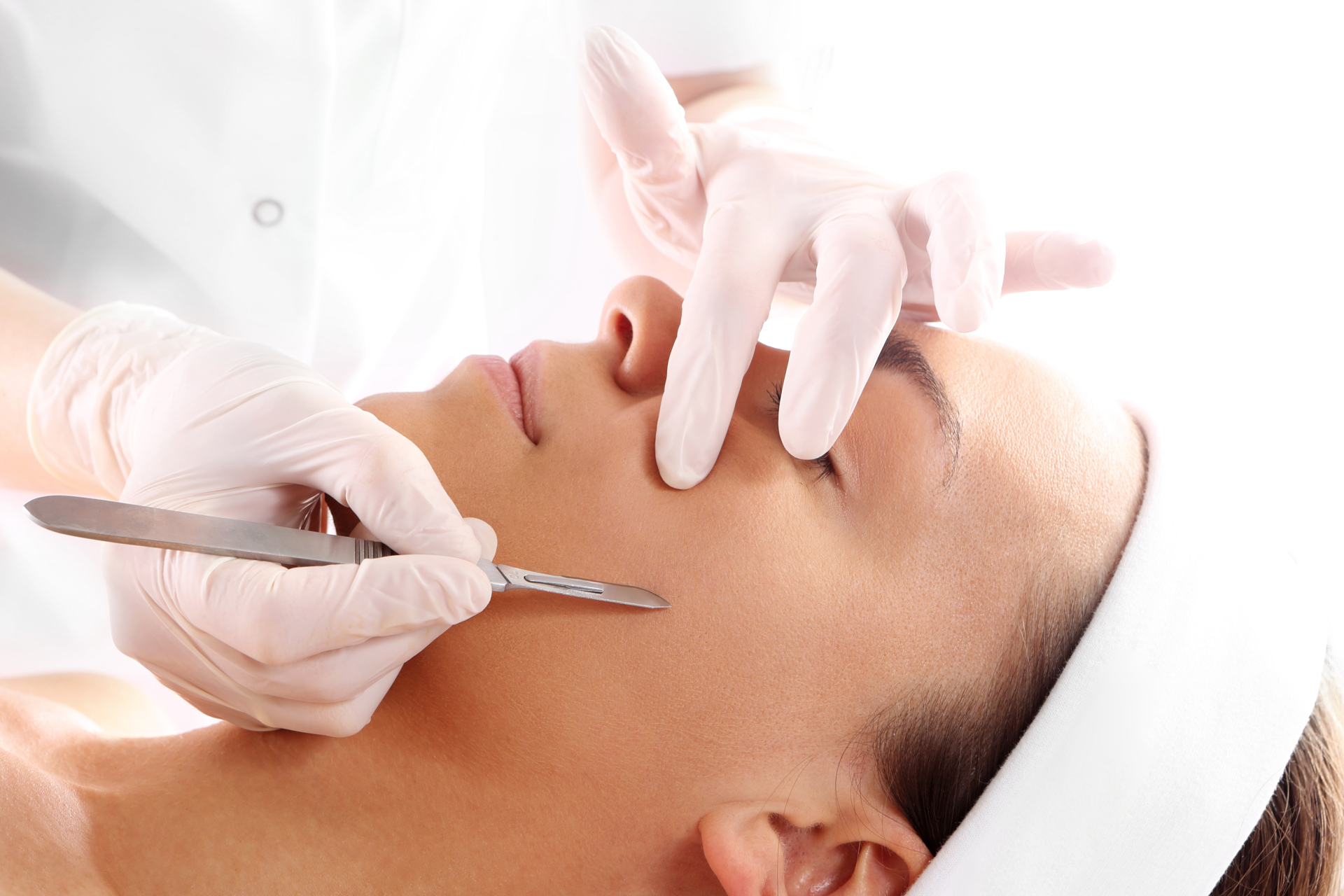 Woman undergoing dermaplaning procedure