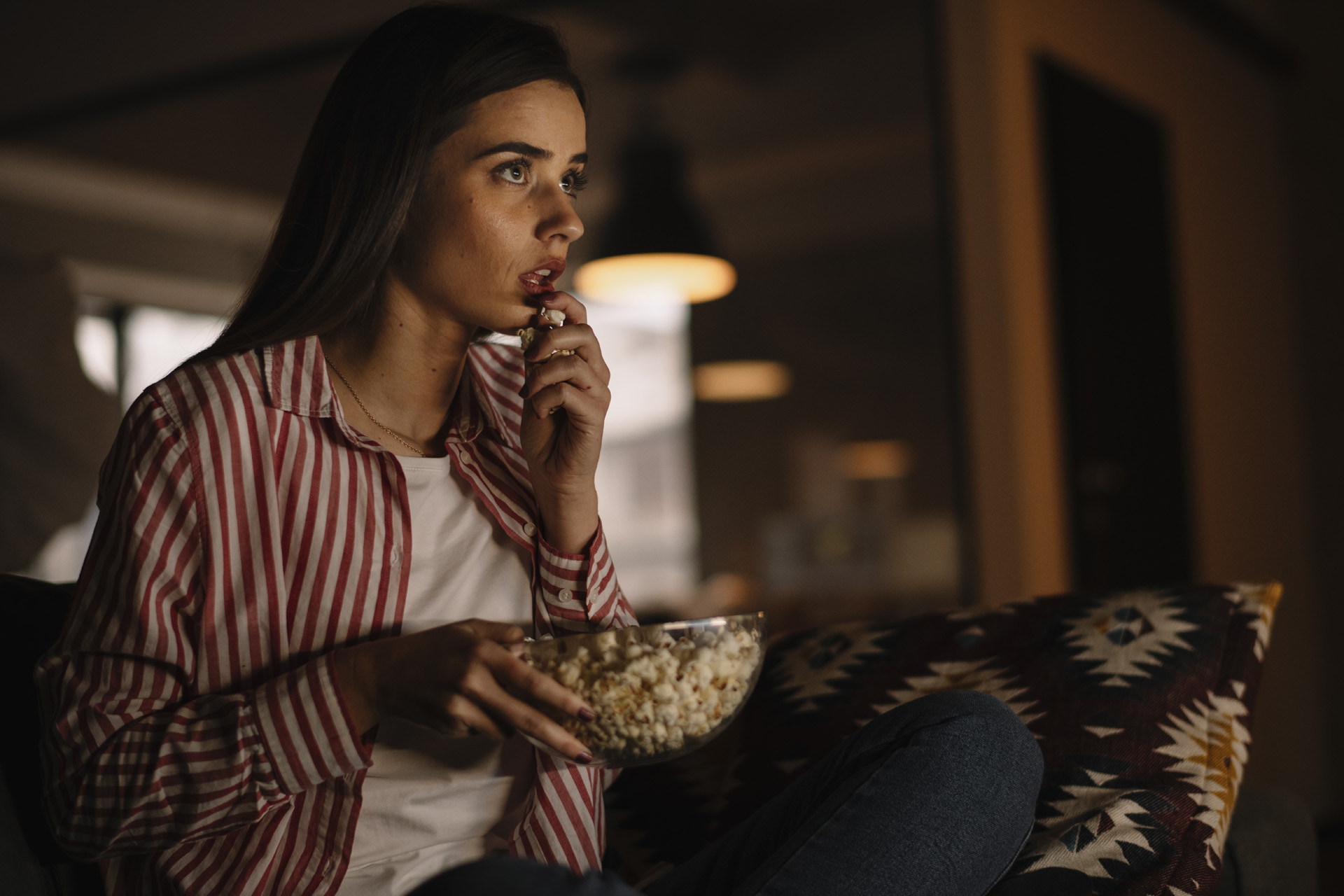 A girl watching a horror film