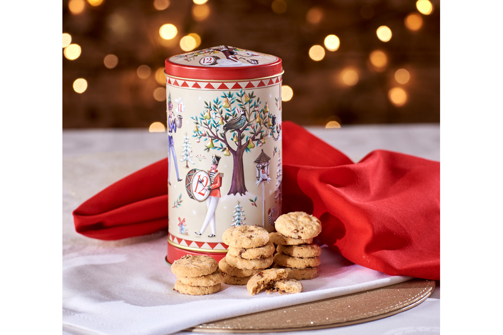 Red and white tin with biscuits and red cloth