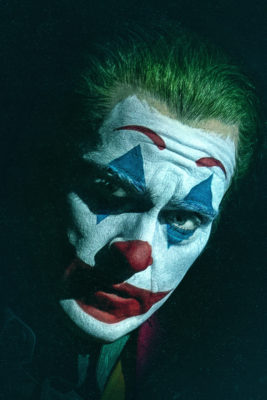 Joaquin Phoenix dress up as the Joker in clown makeup