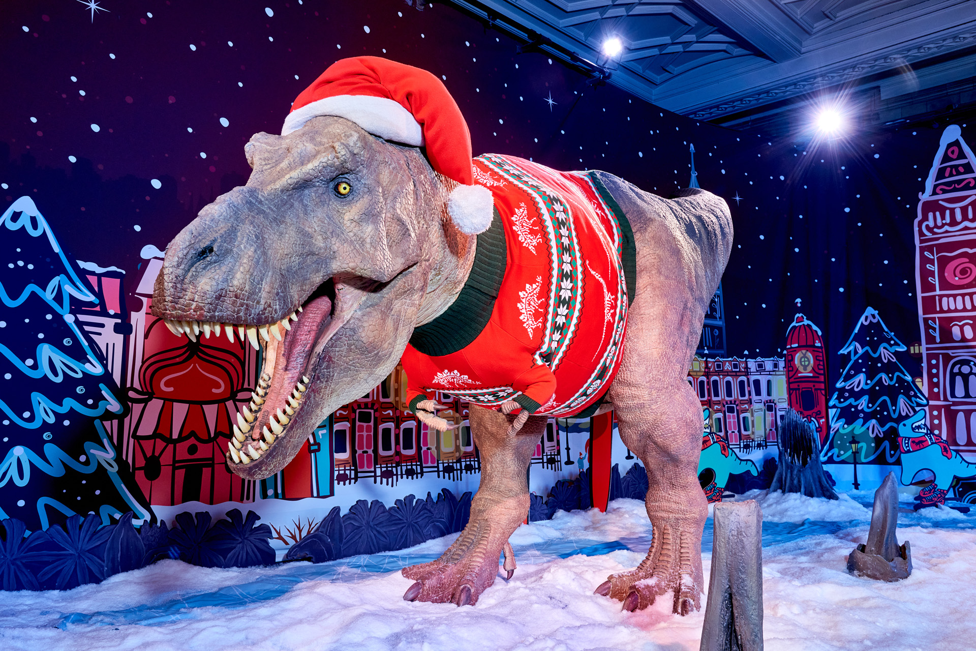 T-rex with Natural History Museum 2023 Christmas jumper (and hat)