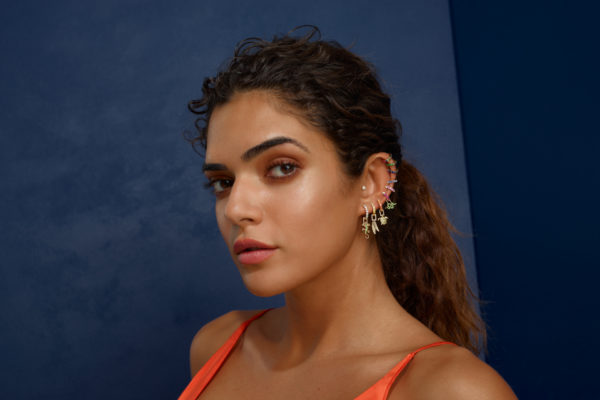 Woman with multiple ear piercings