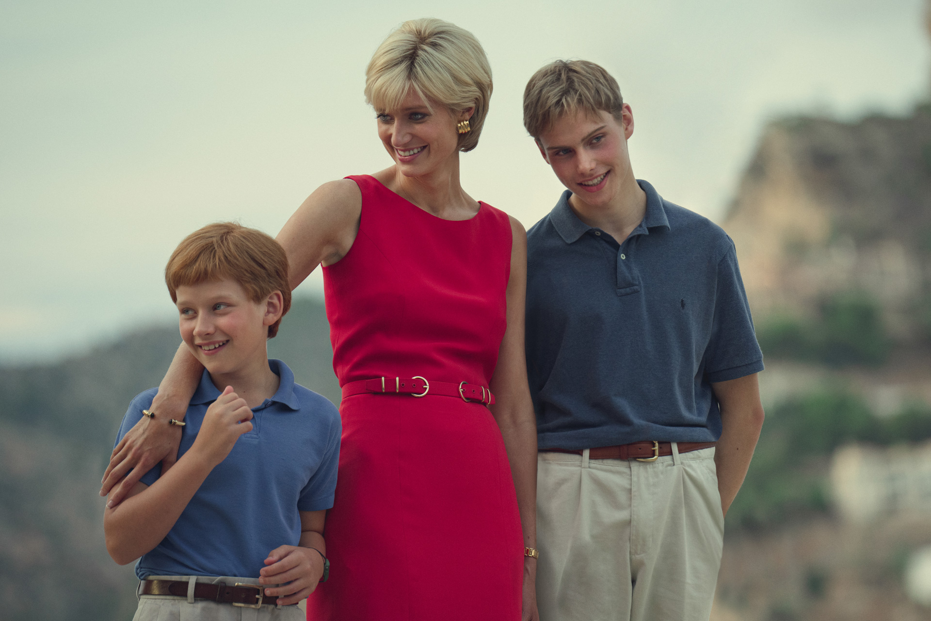 Elizabeth Debicki as Princess Diana in The Crown, standing with Prince Harry and Prince William
