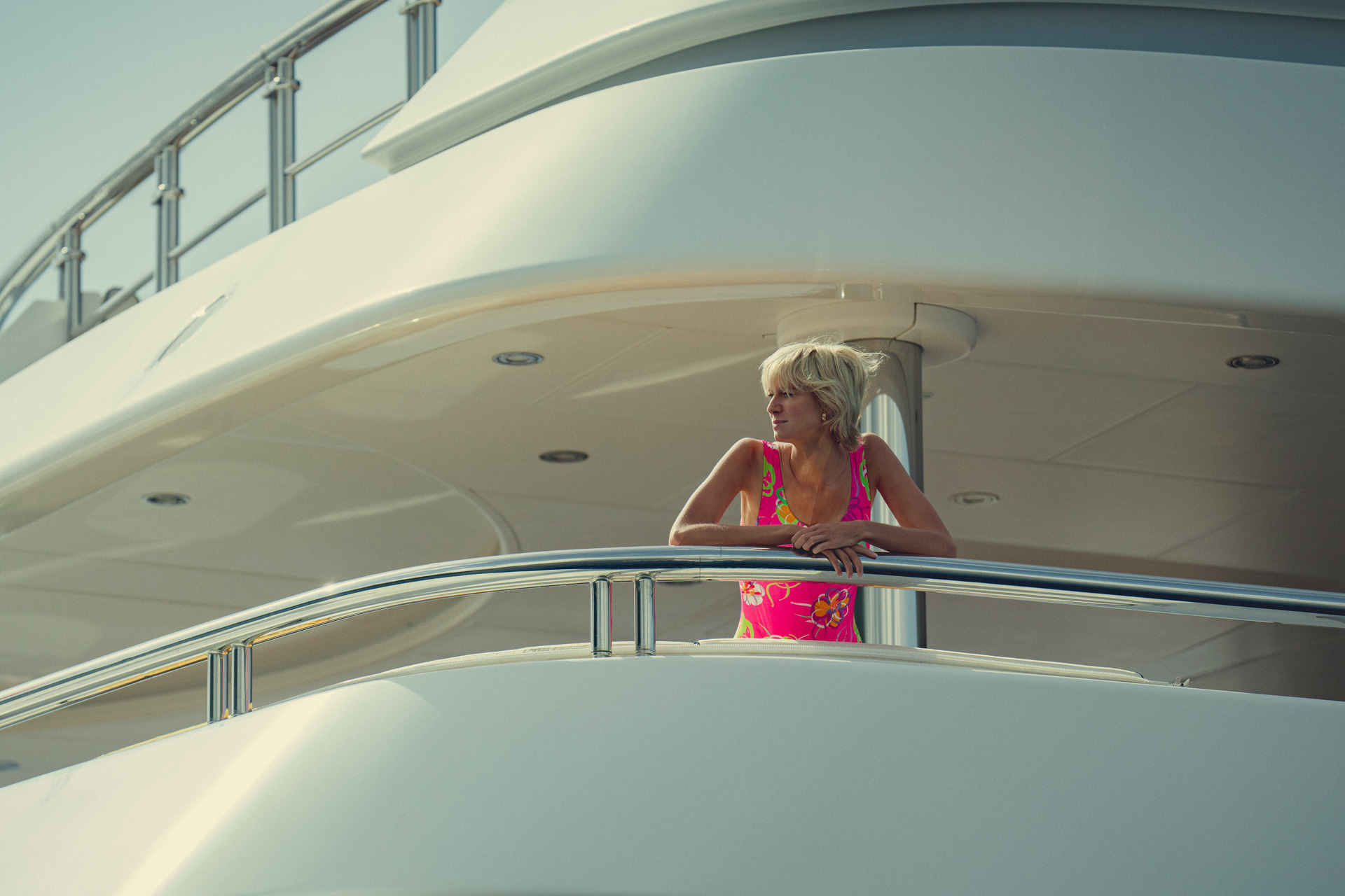 Elizabeth Debicki as Diana in The Crown season six, standing on a yacht