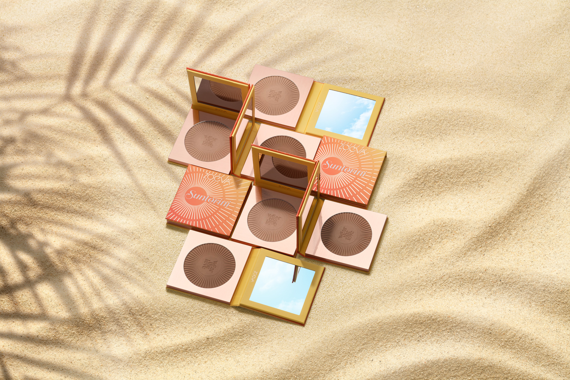 Makeup compacts on sand
