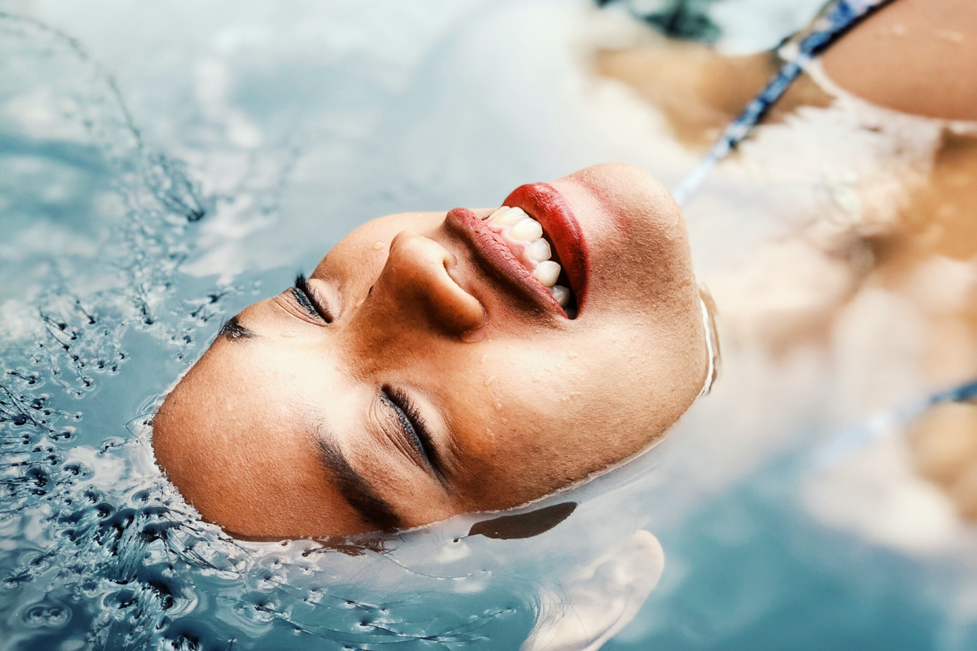 Woman with head partially submerged in water