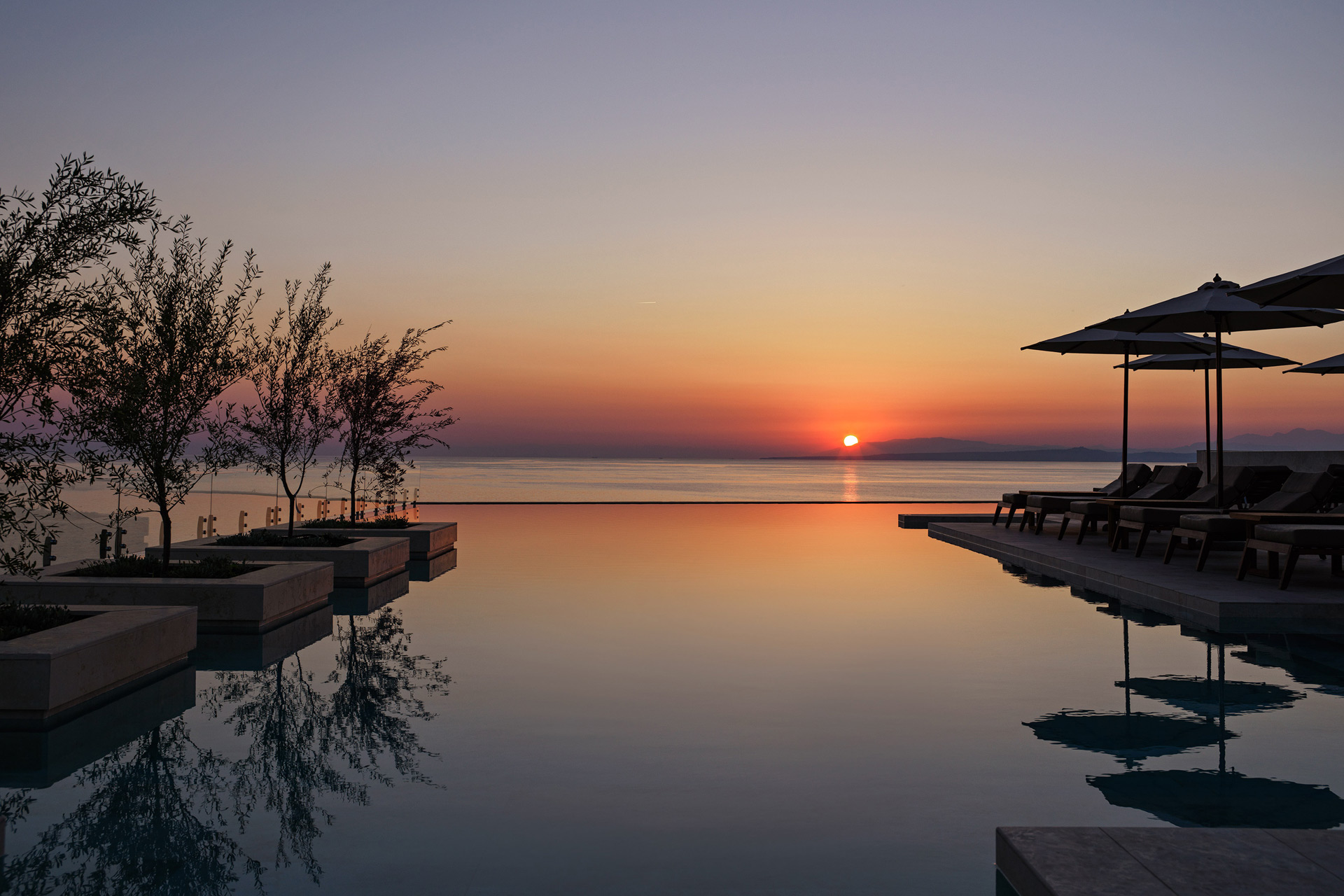 Outdoor pool at sunset