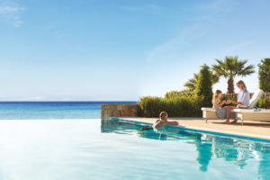 Sani Resort - family relaxing by the pool